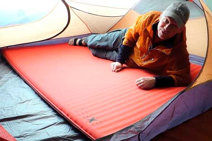 Senior Man In Tent On Sleeping Pad
