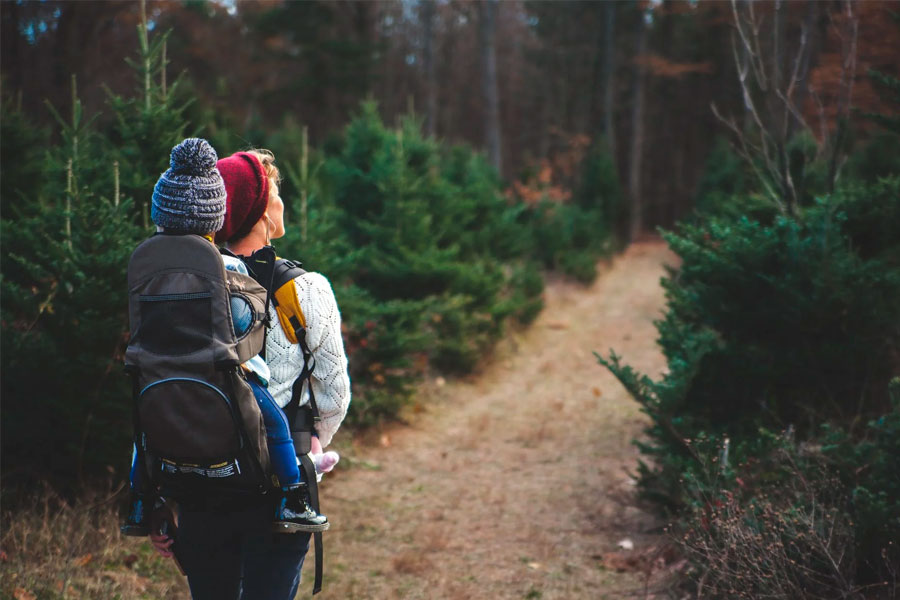 woman mother hiking with baby